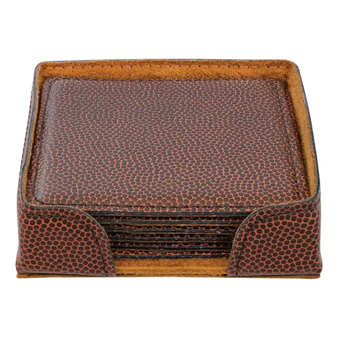 Set of brown leather coasters with a matching holder on a white background