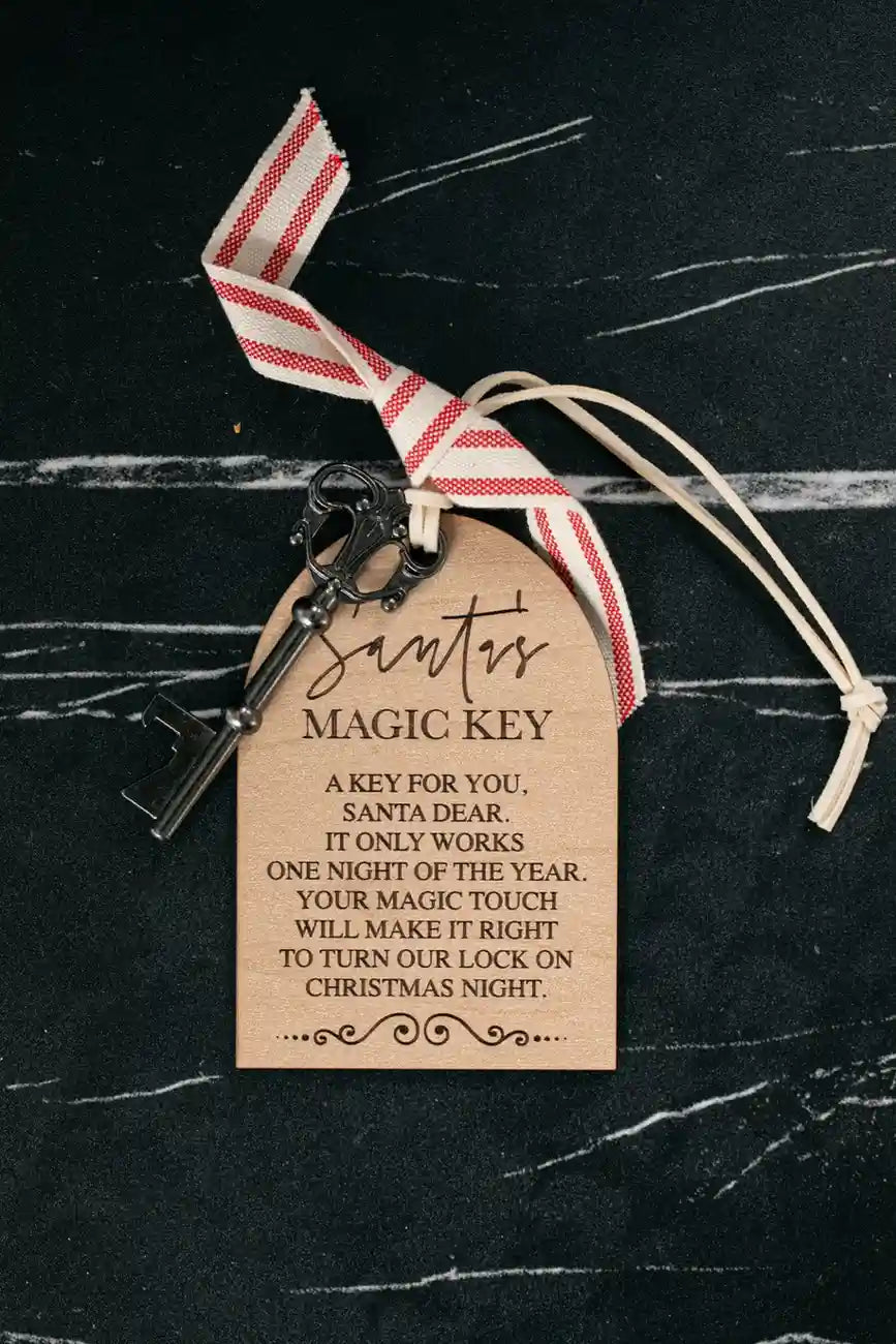 Santa's Magic Key with a tag on a black background
